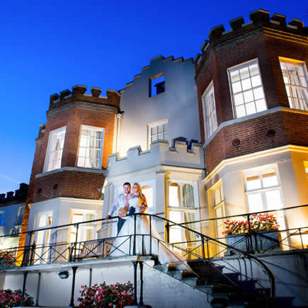 Bride and groom on staircase outside Taplow House Hotel Buckinghamshire - Mark Sisley Photography